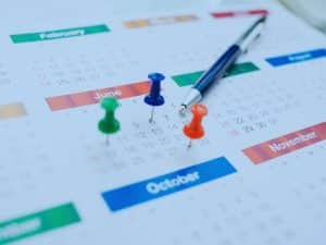 Image of calendar with pins in it, visualising how long does financial planning take